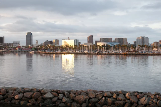 Long Beach skyline and marina reflected in the water at dusk