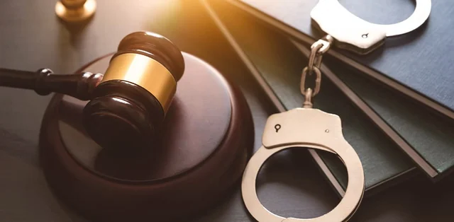 Still life of a gavel and handcuffs